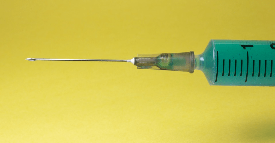 A syringe needle.